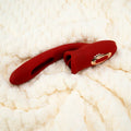Trinity rabbit stimulateur point G rouge posé sur un plaid